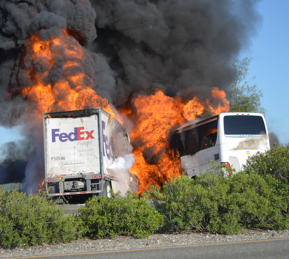 Massive flames engulfed a tractor-trailer and a tour bus just after they collided on Thursday near Orland, Calif.