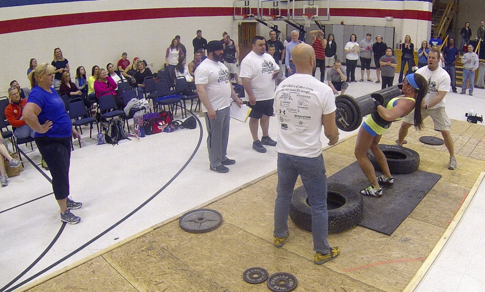 Strongman: Hollie MacKenzie wins the max log clean during the Central Maine Strongman 7 competition on Saturday at Augusta Armory. Increasingly heavier weights are added to the metal log each round until only one last competitor can lift it.