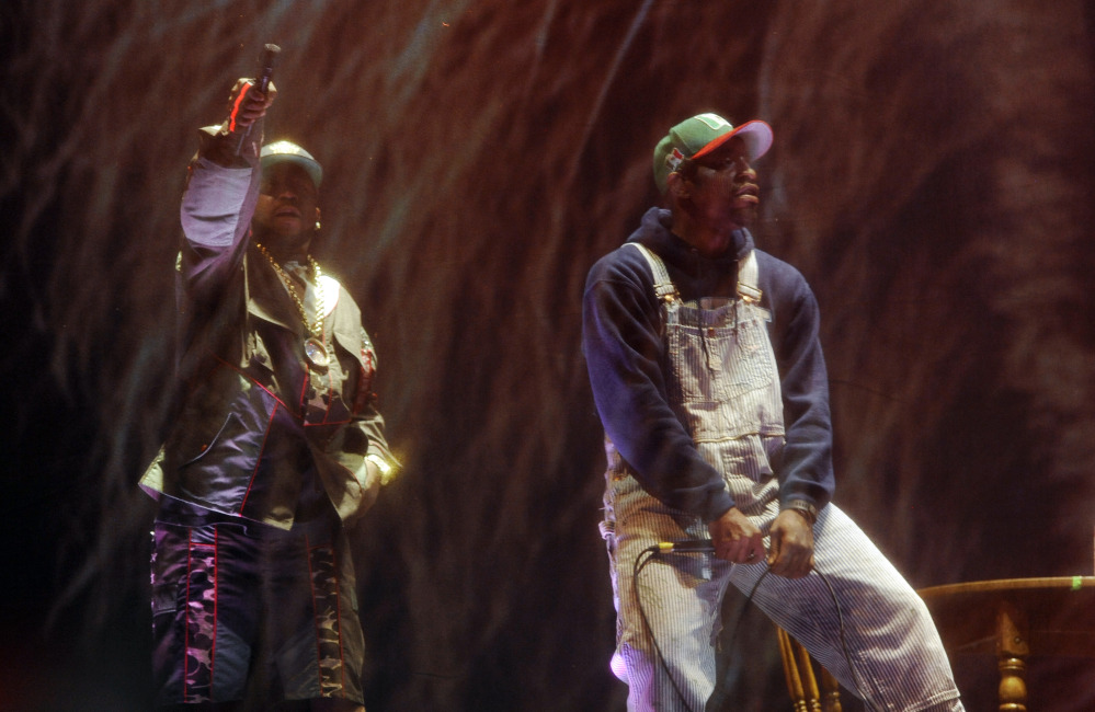 Big Boi, left, and Andre 3000 of Outkast perform behind a screen during their headlining set on the first day of the 2014 Coachella Music and Arts Festival on Friday in Indio, Calif.