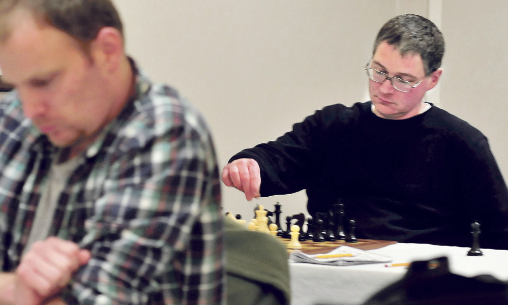 THE MOVE: Master chess player Jarod Bryan, right, of Augusta makes a move against Mathew Fishbein of Cape Elizabeth during the final match of the two-day main Closed Chess Championship on Waterville on Sunday. Bryan won his sixth state championship when he beat Fishbein.