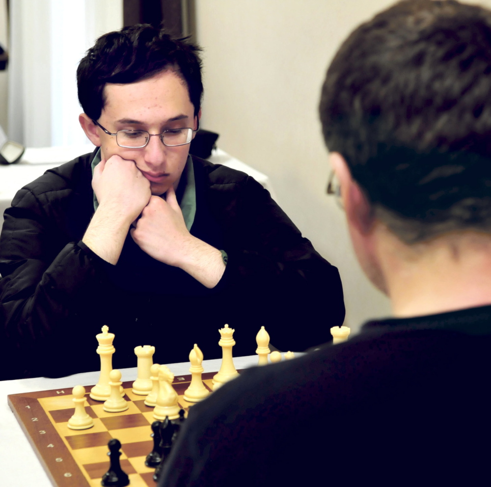 THE MASTERS: Master chess player Mathew Fishbein of Cape Elizabeth ponders his next move against fellow master Jarod Bryan of Augusta during the final match of the two-day Maine Closed Chess Championship in Waterville on Sunday. Bryan beat Fishbein to win his sixth championship.