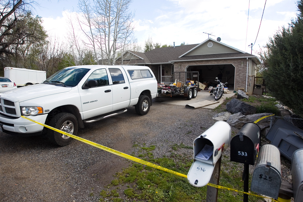 Authorities investigate a crime scene at a house in Pleasant Grove, Utah, where seven dead infants were found in the former home of Megan Huntsman, 39, Pleasant Grove Police Department said.