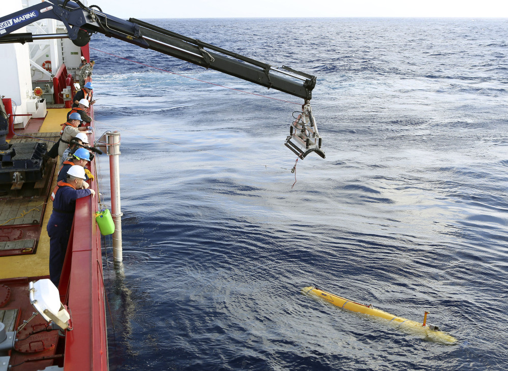 In this Monday, April 14, 2014, photo provided by the Australian Defense Force an autonomous underwater vehicle is deployed from ADV Ocean Shield in the search of the missing Malaysia Airlines Flight 370 in the southern Indian Ocean. The search area for the missing Malaysian jet has proved too deep for the robotic submarine.