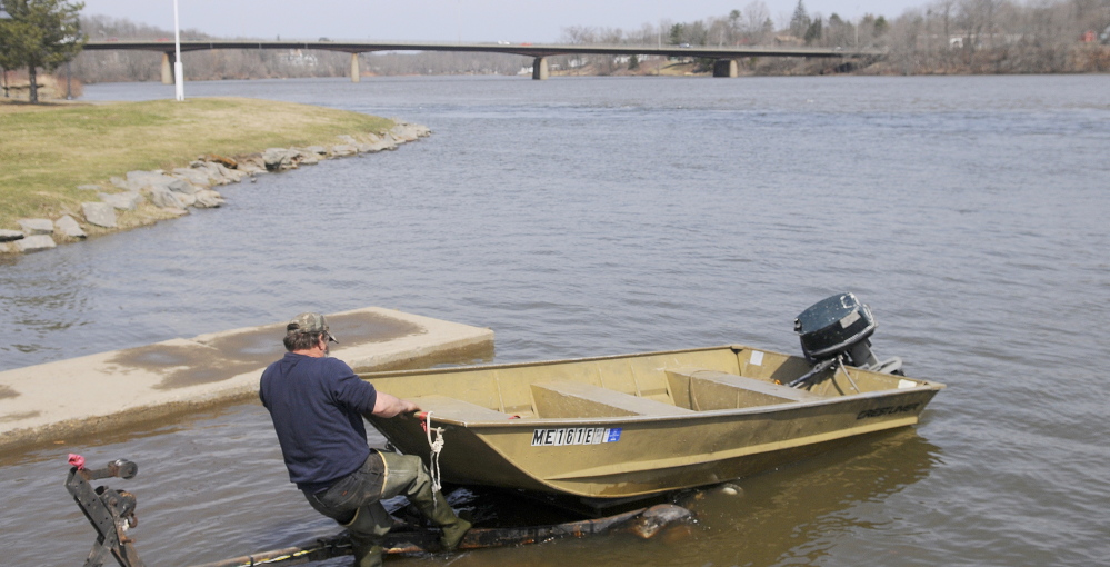 Kevin Lemar of Belfast trailers his vessel Monday at the boat landing on the Kennebec River in Gardiner. Flooding is expected around the river this week because of warm temperatures and rainfall. Lemar, who was fishing for suckers, said conditions on the Kennebec were unpredictable. “Year after year, it’s always different,” Lemar said.