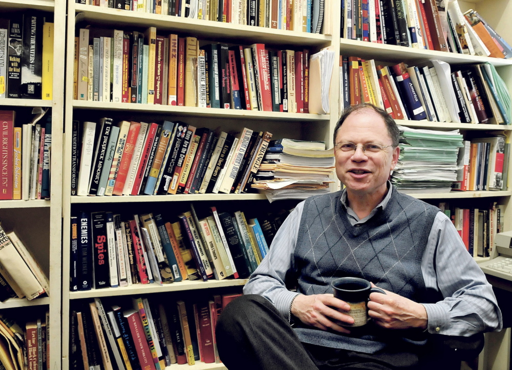 ACCESS: Colby College History Professor Robert Weisbrot in his office in Waterville on Monday, April 14, 2014. Weisbrot is concerned that access to hard copies of books may become a challenge as renovations begin in the college library. Weisbrot said the literature will be in storage which will limit its exposure to students and the public.