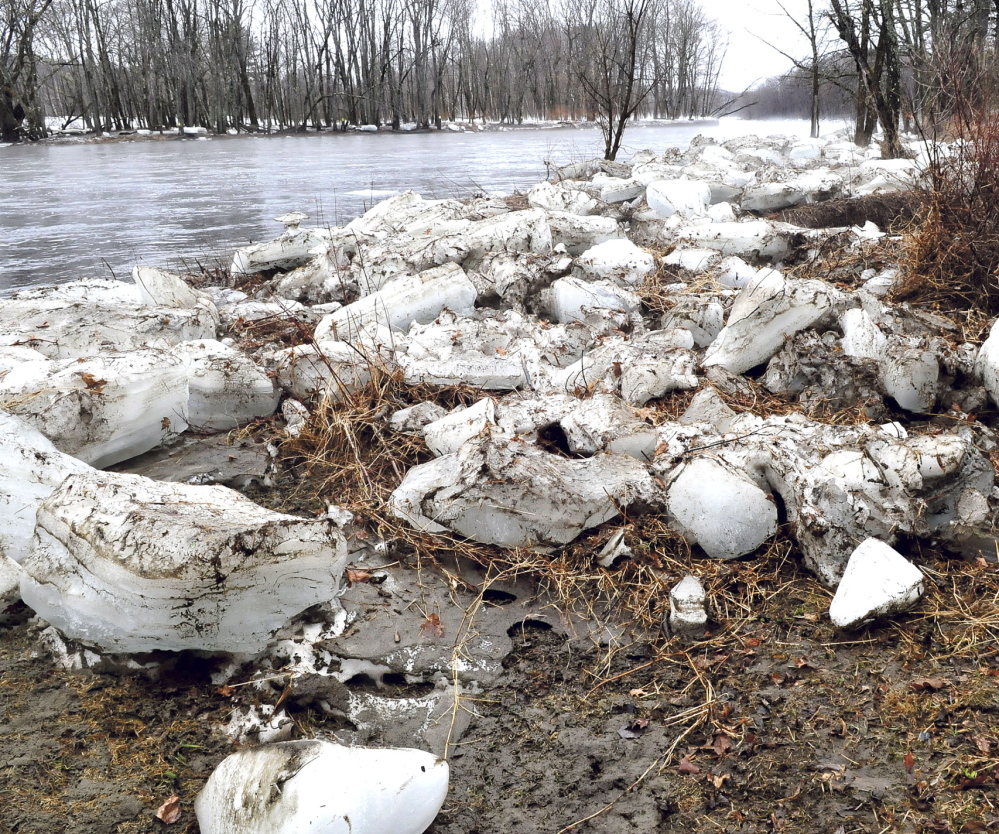 BREAK-UP: Larges chunks of ice are piled up on both sides of the raging Carrabassett River in New Portland on Tuesday.