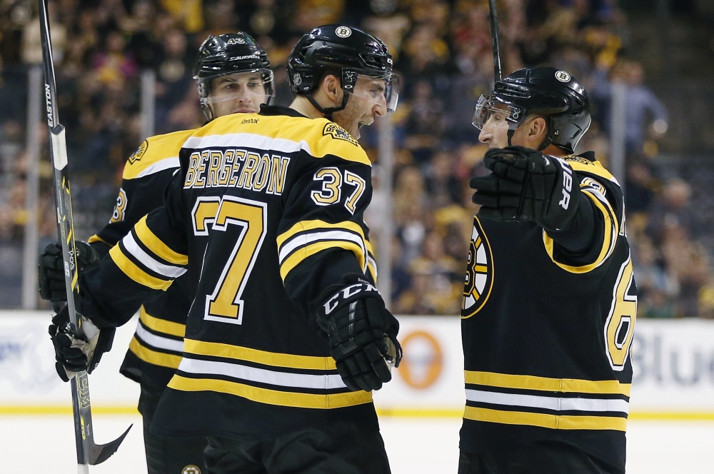 BLAME CANADA: Boston Bruins forward Patrice Bergeron (37) credits the improvement in his game to playing with Canada in the Winter Olympics in Sochi, Russia.