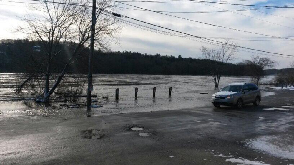 Floodwater covers Front Street in Hallowell on Wednesday morning. Some streets in both Hallowell and Augusta were closed Wednesday. The river is expected to recede Thursday.