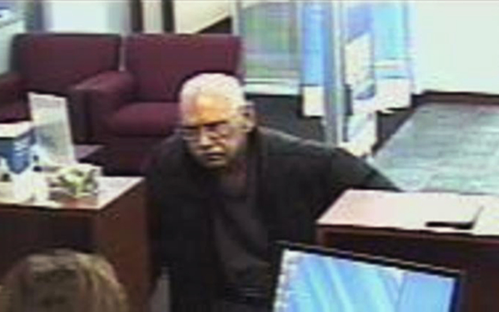 A surveillance photo provided by the FBI shows 73-year-old Walter Unbehaun, an ex-convict from Rock Hill., S.C., during a bank robbery in Niles, Ill., on Feb. 9, 2013.