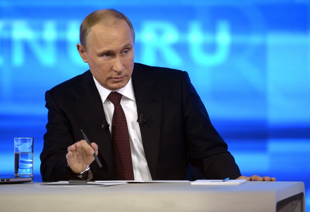 Russian President Vladimir Putin speaks during a nationally televised question-and-answer session in Moscow on Thursday. Putin has urged an end to the blockade of Moldovaís separatist province of Trans-Dniester. Trans-Dniester, located in eastern part of Moldova on border with Ukraine, has run its own affairs without international recognition since a 1992 war. Russian troops are stationed there.