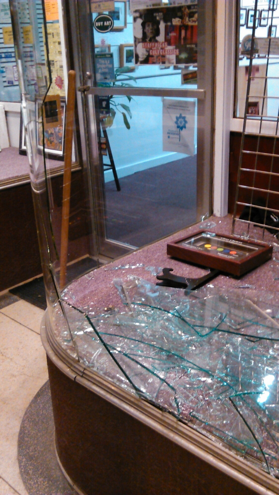 Broken: Smashed glass at Framemakers in downtown Waterville.