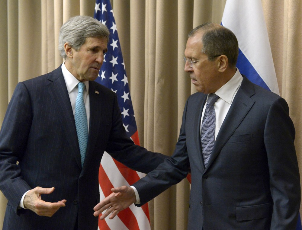 U.S. Secretary of State John Kerry, left, shakes hands with Russian Foreign Minister Sergey Lavrov before a bilateral meeting to discuss the ongoing situation in Ukraine as diplomats from the U.S., Ukraine, Russia and the European Union gather for discussions in Geneva.