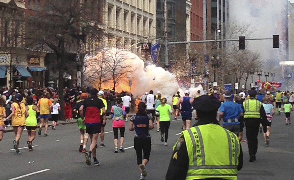 An explosion erupts near the finish line of the Boston Marathon on April 15, 2013. It was followed by another 12 seconds later. Among those who rushed to victims’ aid was John Mixon of Ogunquit, who helped rip openings in a crowd-control barrier that was obstructing first responders. Mixon has endured his father’s death and a near-fatal heart attack himself in the year since, but he’ll be back at the marathon finish line Monday supporting Run for the Fallen participants.