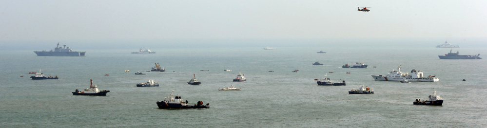 Ships continue the search for passengers of the sunken ferry Sewol in the water off the southern coast near Jindo, South Korea, on Sunday.