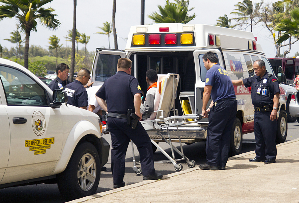 A 16-year-old boy who stowed away in the wheel well of a flight from San Jose, Calif., to Maui is loaded into an ambulance at Kahului Airport in Kahului, Maui, on Sunday afternoon.