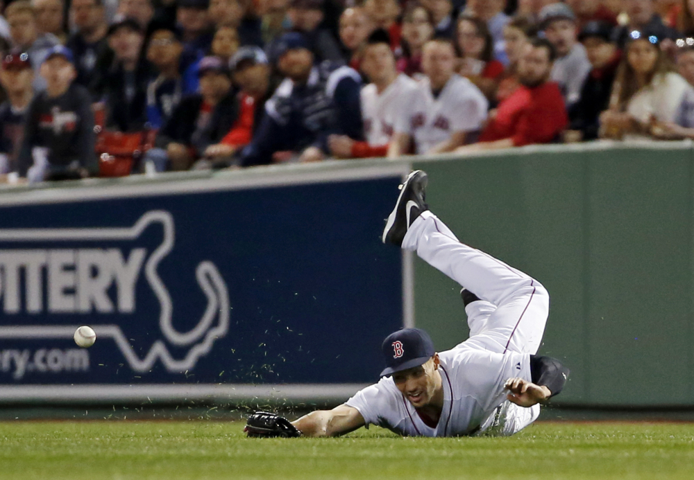 Red Sox right fielder Grady Sizemore dives but cannot catch a single by Yankees’ Brian Roberts during the third inning at Fenway Park on Tuesday.