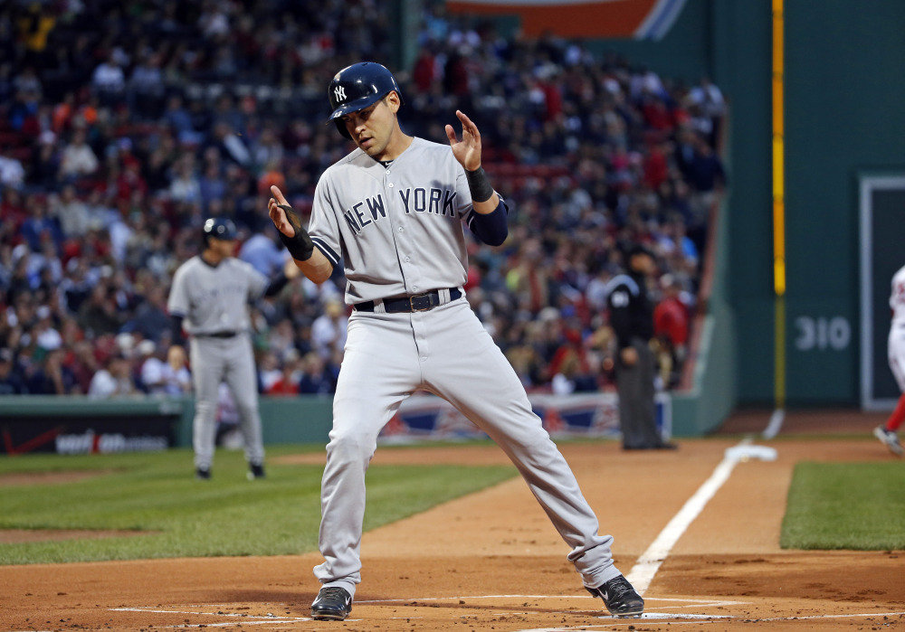 Yankees’ Jacoby Ellsbury crosses home plate to score on a single by Derek Jeter during the first inning Tuesday in Boston.