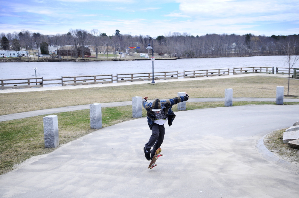 HIS ROLL IN LIFE: Chris Colby, 21, of Randolph, skateboards Monday at the area the city of Gardiner has designated for boarders along the Kennebec River.