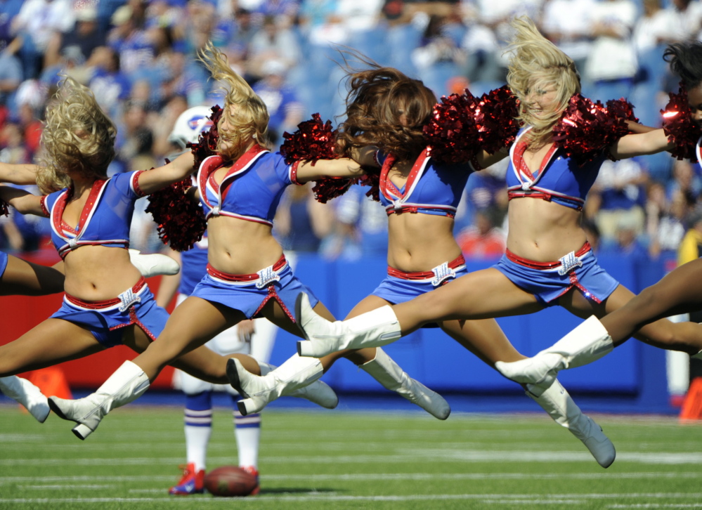 Buffalo Bills cheerleaders are shown performing during a game in 2013. Five former members of the squad have filed a lawsuit over pay.