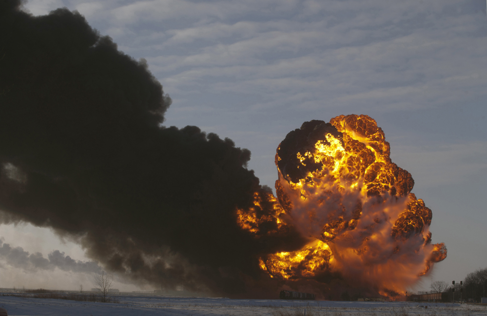 A fireball rises at the site of an oil train derailment in Casselton, N.D. The Department of Transportation is drafting new tank car regulations aimed at making the cars less likely to spill their contents in the event of a crash.