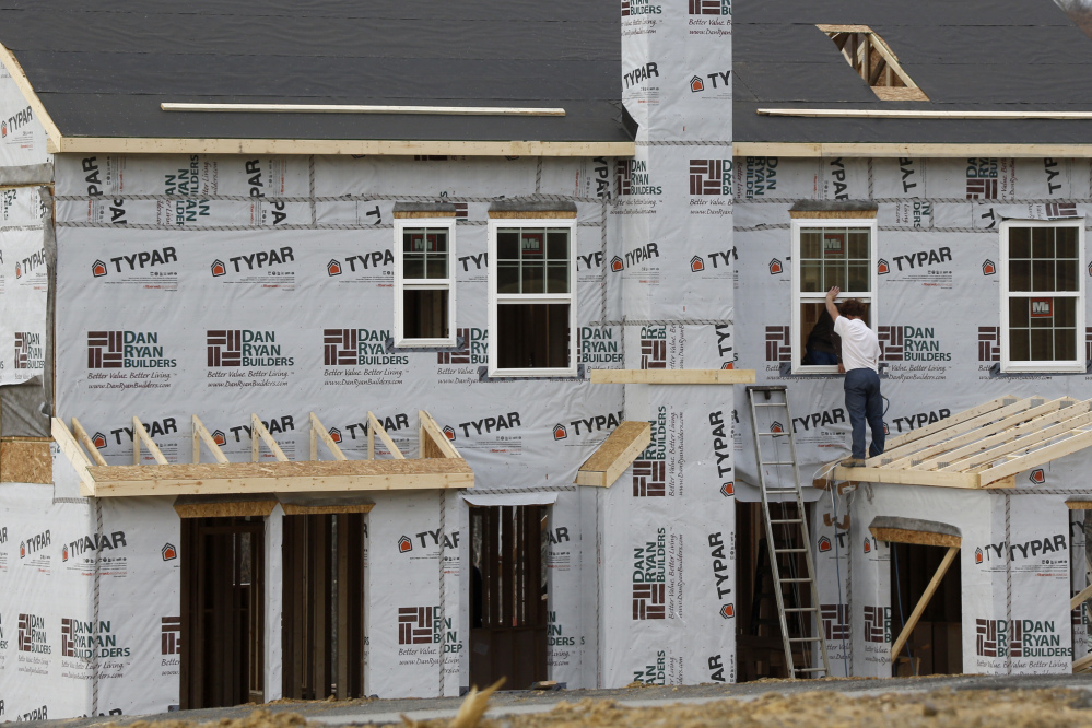 Construction continues in March on housing in Zelienople, Pa. Rising prices and higher mortgage rates have made it harder for many Americans to afford a home.