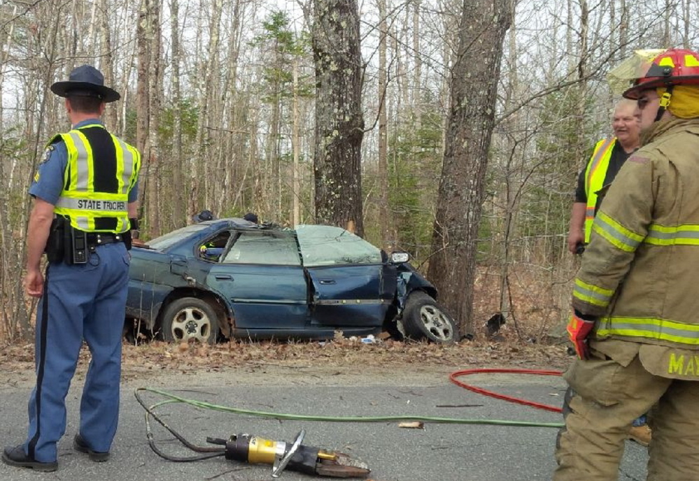 KILLED INSTANTLY: State Police troopers inspect the scene of the crash that killed Aundria St. Amand of South China.