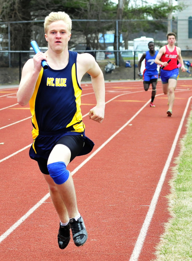Staff photo by David Leaming Mt. Blue's Nate Backus leads in the distance medley race during a track meet in Waterville on Thursday, April 24, 2014.