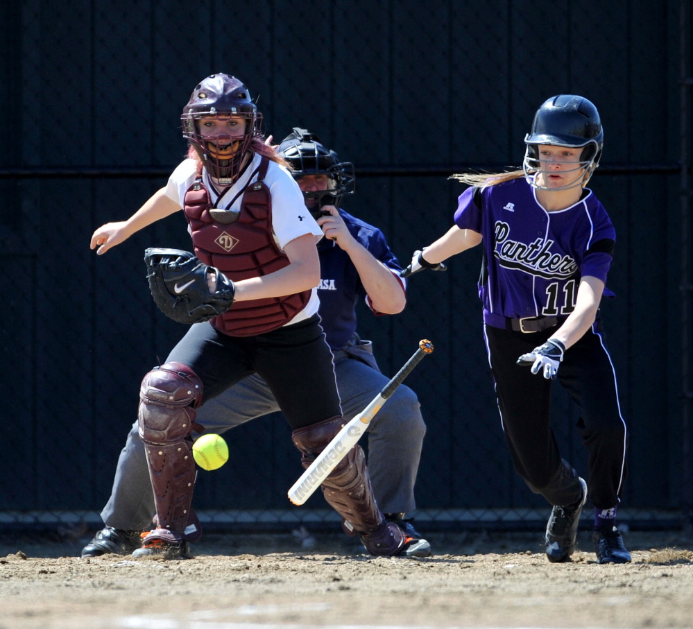 Staff photo by Michael G. Seamans Watreville Senior High School's Brooklyn LeClair, 11, lays down a bunt against Maine Central Institute in the second inning in Waterville.