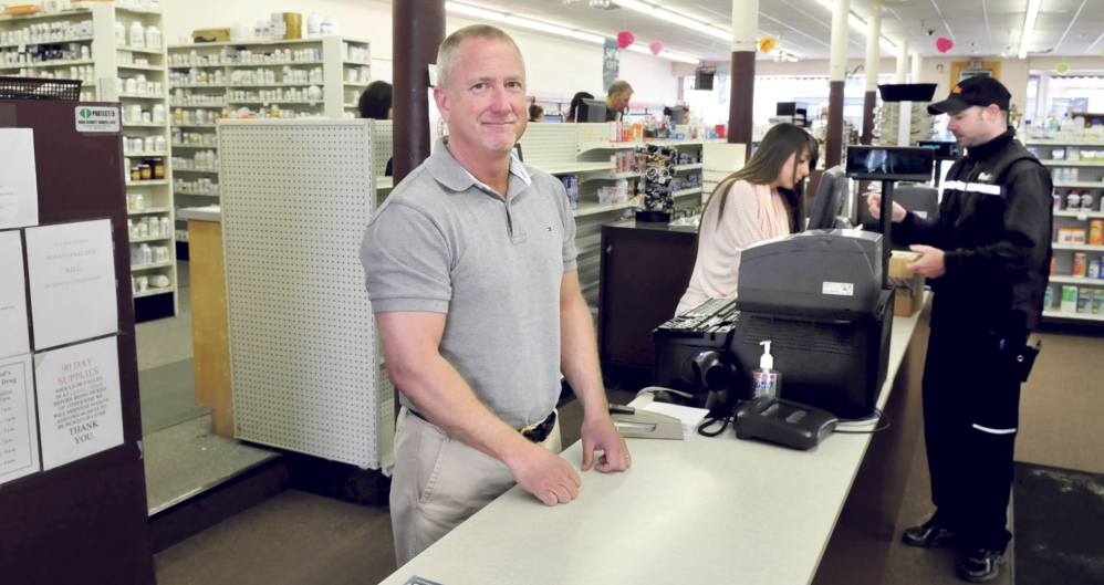 MOVING: Kevin Holland stands behind the counter Thursday at his Variety Drug store in Skowhegan. Holland is planning to move the business a short distance away to the former USDA lot in town.