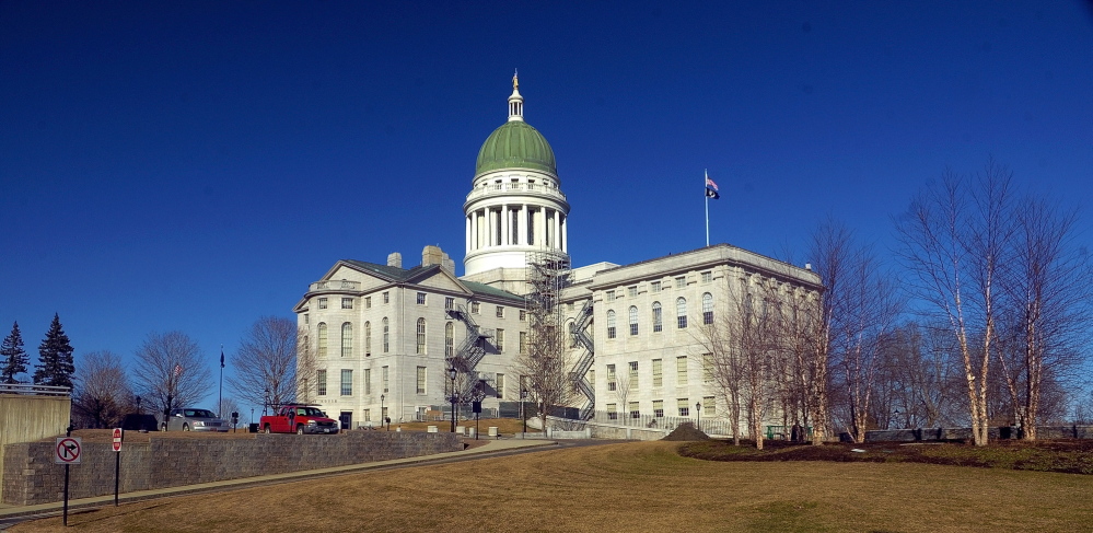Changes: File photo of Maine State House taken on April 1 shows scaffolding beginning to be built around the dome in Augusta.