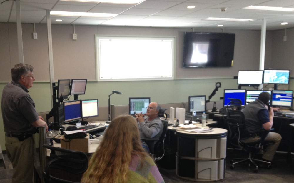 Going live: Dispatchers test equipment Friday at the new Franklin County Communications Center. The building, across from the sheriff’s department on County Way in Farmington, opened that day.