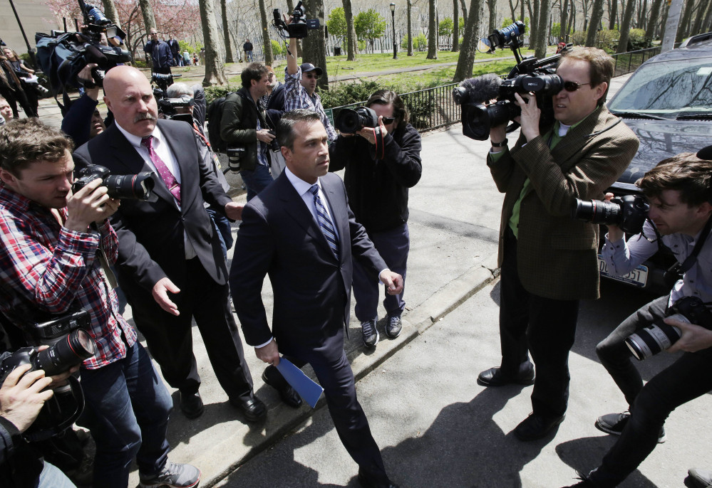 U.S. Rep. Michael Grimm leaves a news conference in a park next to federal court on Monday in Brooklyn.