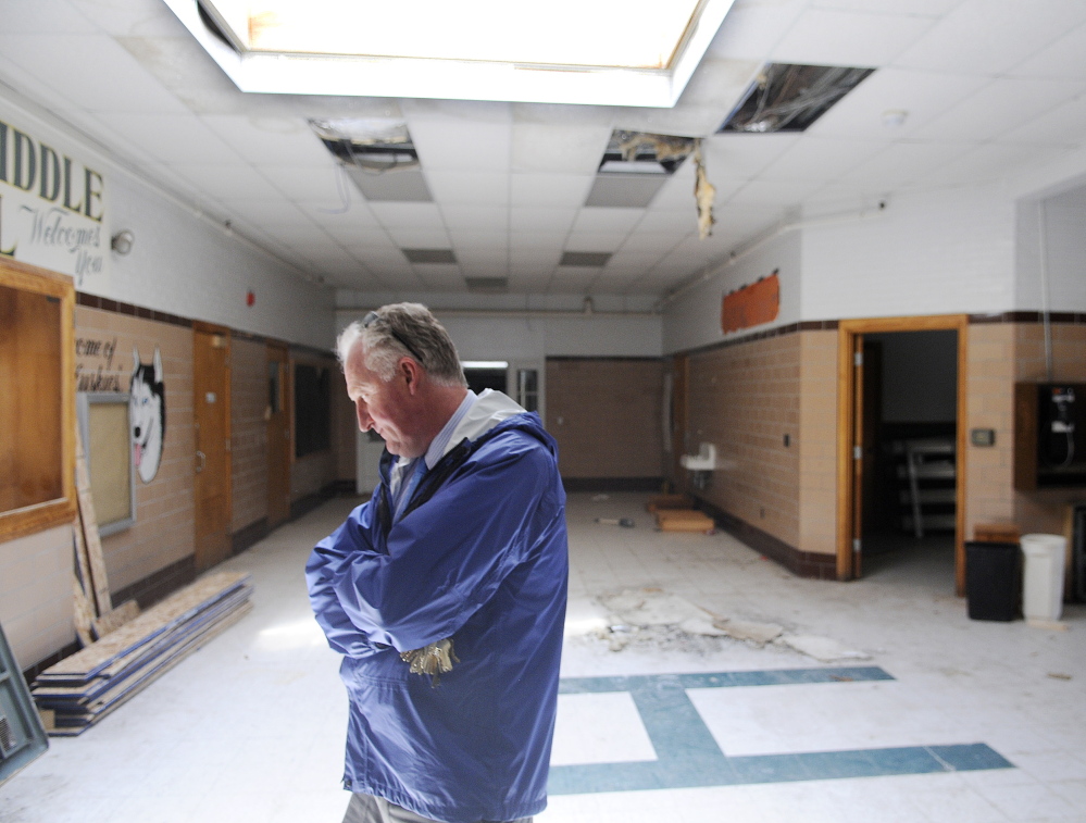 RIPE FOR REHABILITATION: City of Augusta Facilities Manager Bob LaBreck enters the lobby Tuesday of the former Hodgkins Middle School in Augusta.