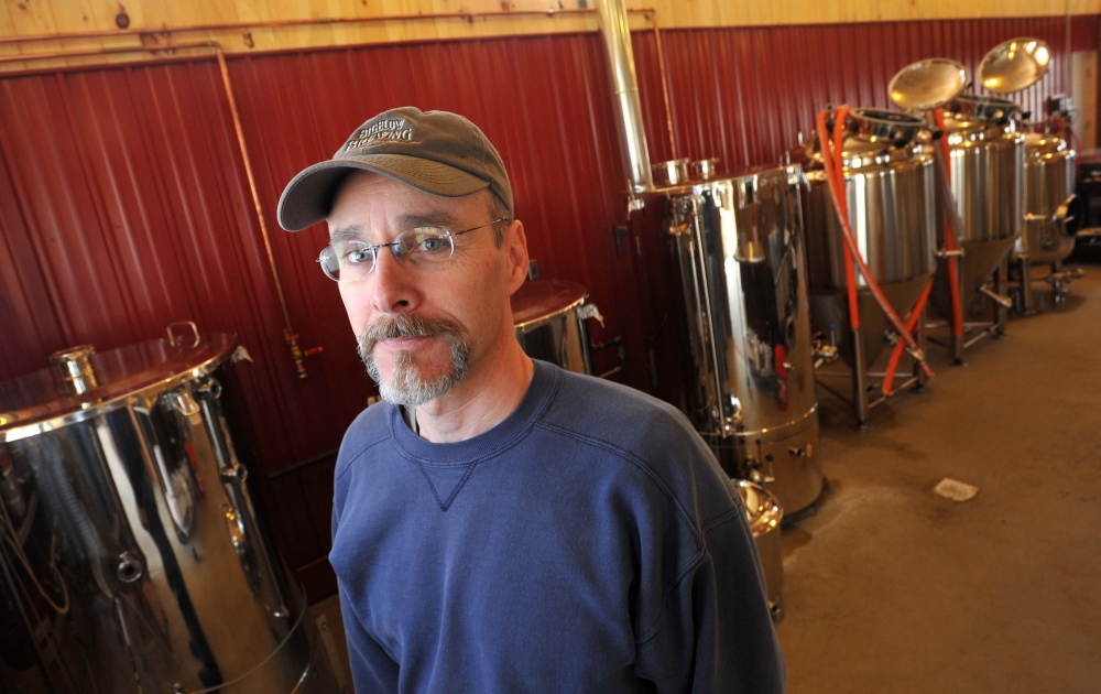 Staff photo by Michael G. Seamans Jeff Powers, owner of Bigelow Brewing Company, stands among his vats in his brewery in Skowhegan on Tuesday. Bigelow Brewing Company has an open house on Saturday at the 473 Bigelow Hill Road location and will be offering free samples.