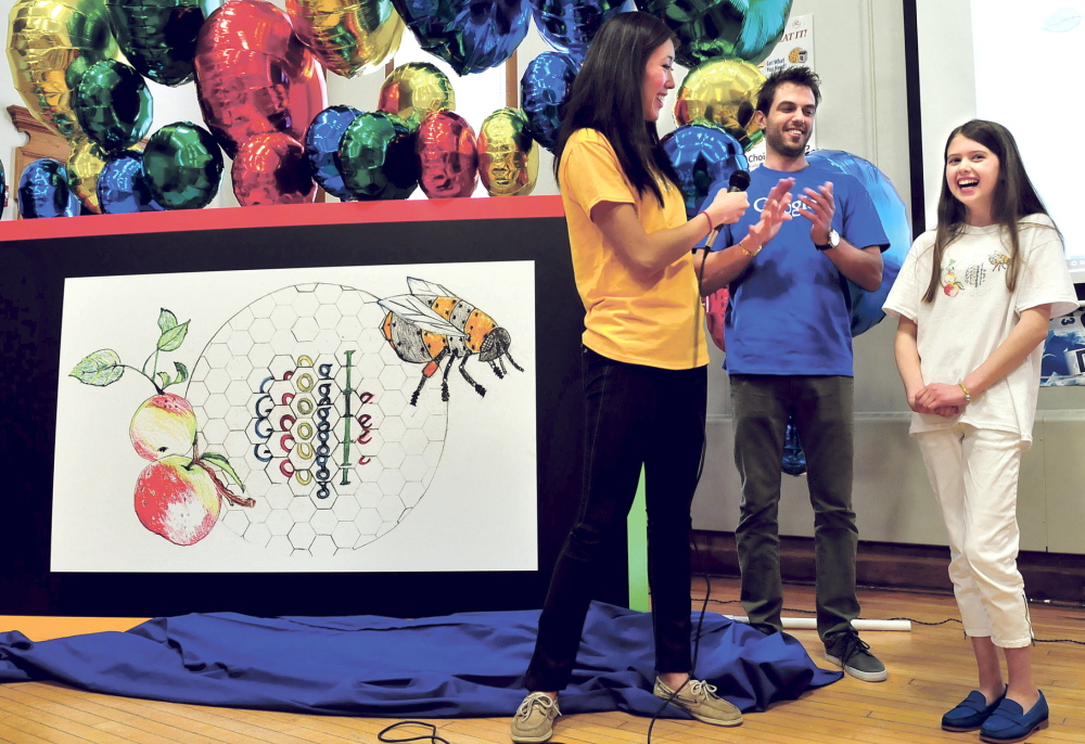 GOOGLE THIS KID: Sally Zhao and Sean Ivester of Google and the students and staff at the Albert Hall School in Waterville applaud fifth-grader Inga Zimba and her unveiled winning artwork in a national contest for the next theme for Google on Tuesday.