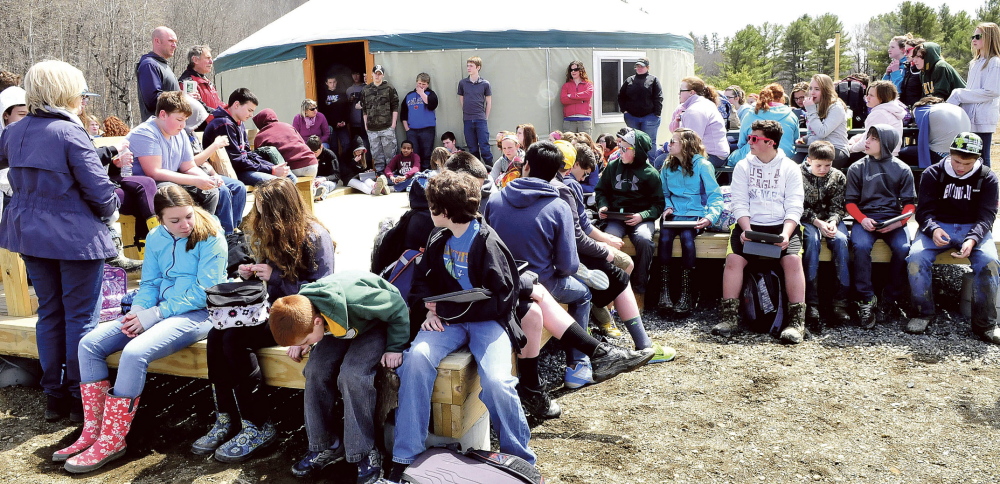 TRAILBLAZERS: Warsaw Middle School students listen to Matt Skehan, upper left, director of Waterville’s Parks and Recreation Department, and former president of Kennebec Messalonskee Trails Peter Garrett on Tuesday at the Quarry Road Recreation Area.