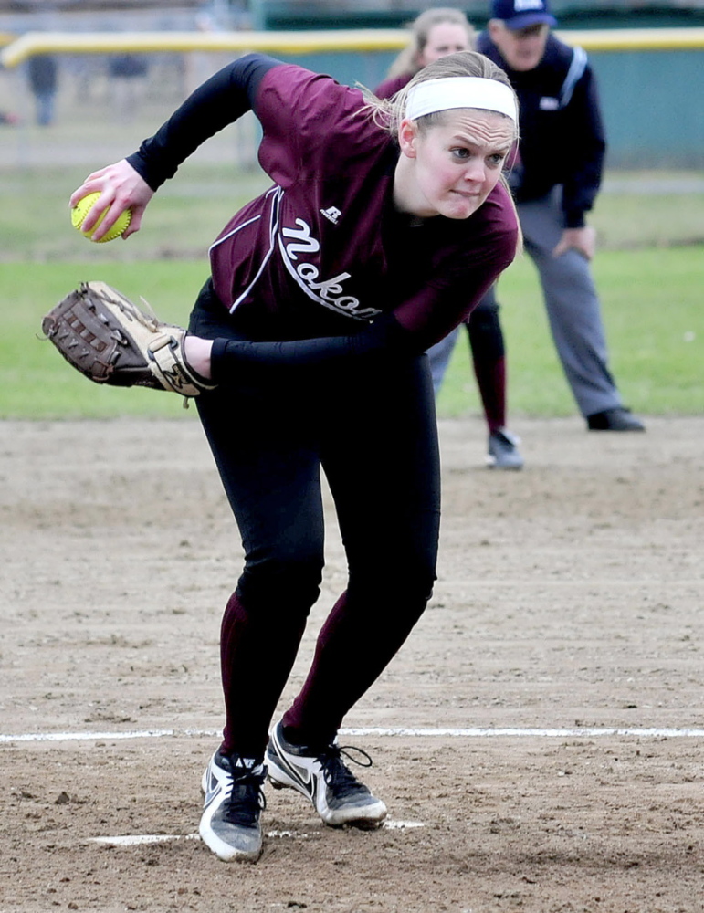 Staff photo by David Leaming INTENSITY: Nokomis softball pitcher Sara Packard winds up to throw against a Winslow batter recently.