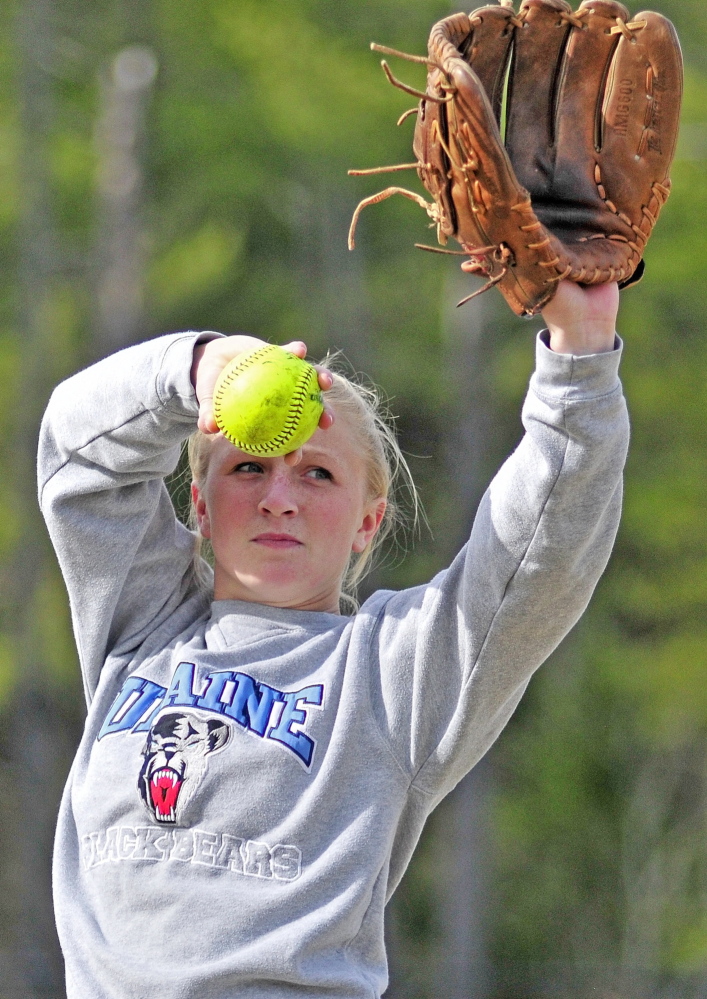 Staff photo by Joe Phelan Cony pitcher Arika Brochu throws long toss during practice on Tuesday April 29, 2014 at Cony Family Field in Augusta.