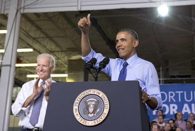 Vice President Joe Biden applauds, at left, as President Barack Obama gives the thumbs up as he speaks at the Community College of Allegheny County West Hills Center, Wednesday, April 16, 2014, in Oakdale, Pa., about the importance of jobs-driven skills training.