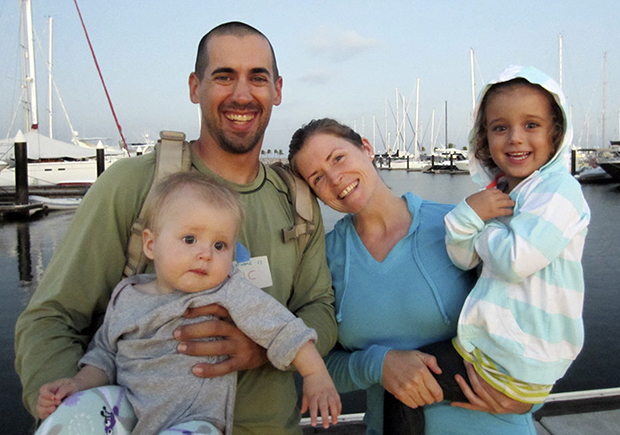 Eric and Charlotte Kaufman are shown with their daughters, Lyra, 1, and Cora, 3.