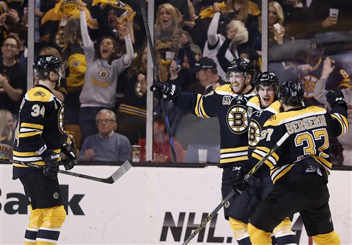 Boston Bruins' Loui Eriksson, second from right, celebrates his goal with teammates during the first period in Game 5 in the first round of the Stanley Cup playoffs against the Detroit Red Wings in Boston on Saturday.