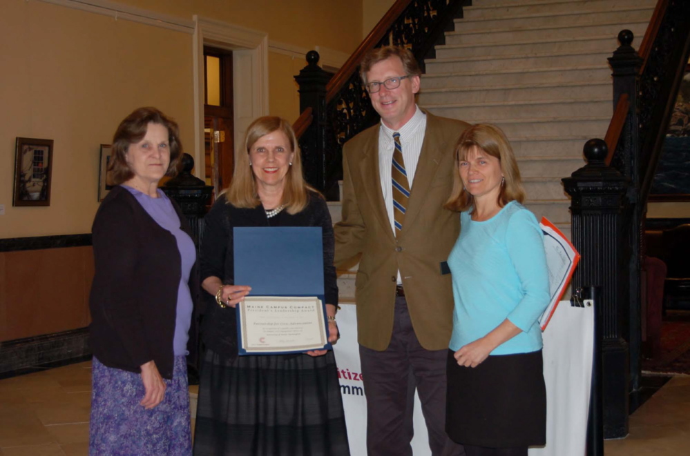 HONORED: The UMF Partnership for Civic Advancement was recently honored by the Maine Campus Compact with the President’s Leadership Award at a ceremony in the State House Hall of Flags in Augusta. The award acknowledges exceptional campus contributions to community service, service learning and civic engagement efforts. From left are Lorraine Pratt, UMF grants writer, and F. Celeste Branham, UMF vice president of student and community services and director of the Partnership for Civic Advancement, received the award from Donald Tuski, president of the Maine College of Art, and Sally Slovenski, executive director of the Maine Campus Compact.