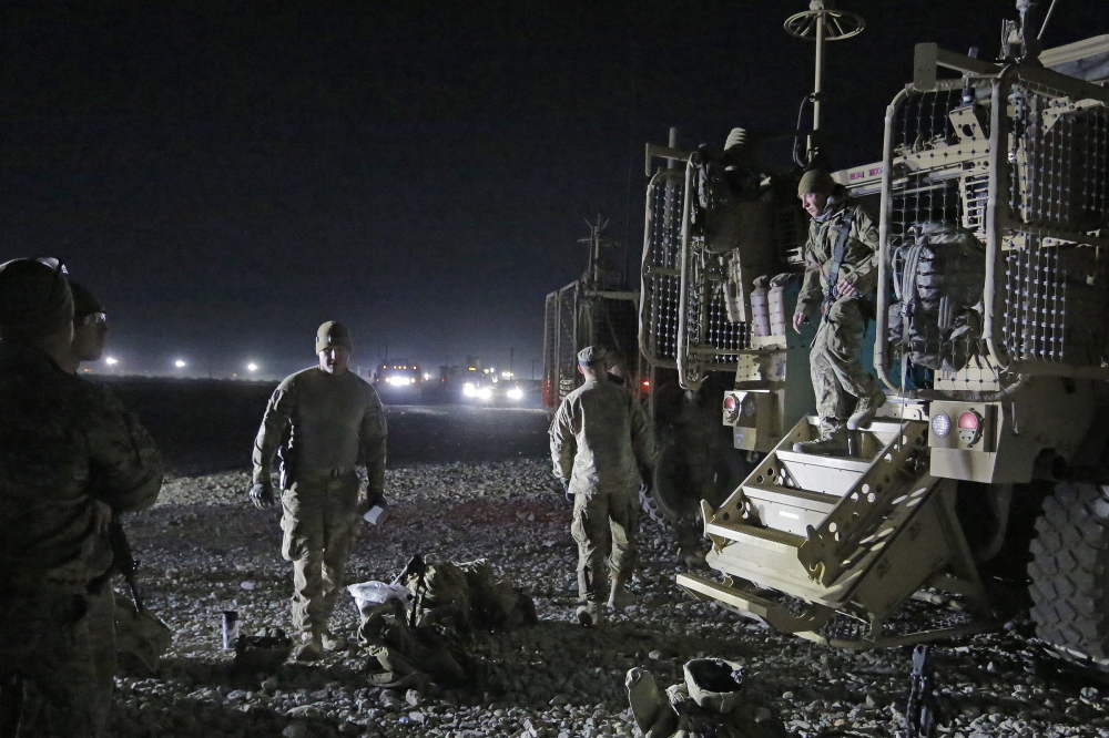 Members of the Convoy Escort Team of the 133rd Engineer Battalion of the Maine Army National Guard prepare to leave Bagram Air Field on Dec. 20 and head to Shank Forward Operating Base, roughly 80 miles to the south.