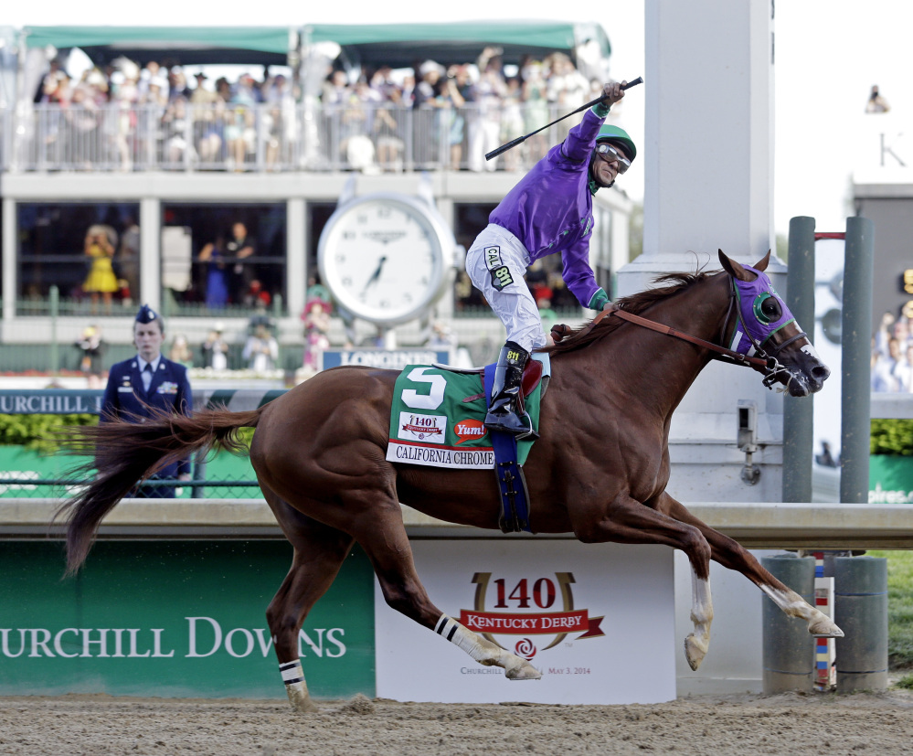 Victor Espinoza rides California Chrome to a victory during the 140th running of the Kentucky Derby horse race at Churchill Downs Saturday, in Louisville, Ky.