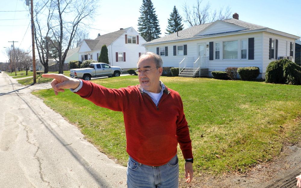 Bruce Poliquin stands in front of his childhood home on Violette Avenue in Waterville on Friday.