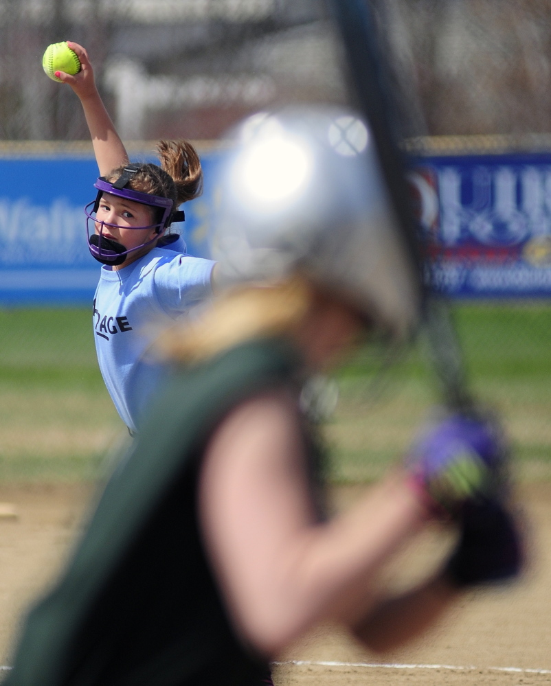 Here’s the pitch: MacPage 10-and-under pitcher Raylee Gilbert throws to a Northwoods batter during opening day of softball season on Saturday at the CAYSA complex in Augusta.