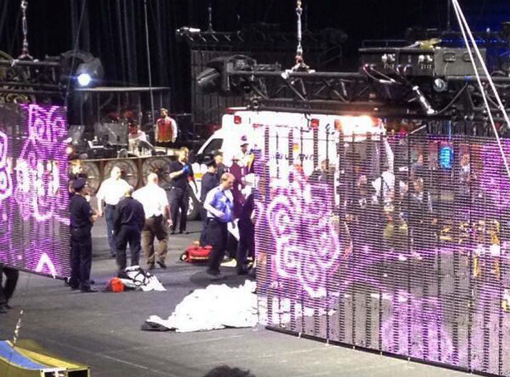 In a cell phone photo provided by Tara Griggs, emergency workers tend to injured performers after a platform collapsed on Sunday during the Ringling Brothers and Barnum and Bailey Circus’ Legends show at the Dunkin’ Donuts Center in Providence, R.I. At least nine people were injured in the fall, including a dancer below.
