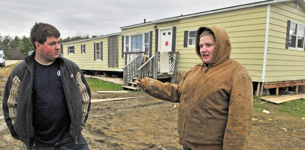 Park problems: John Tuttle, left, and Harley Clifford talk about the problems they’ve had with water being shut off at Meadowbrook Trailer Park last month.