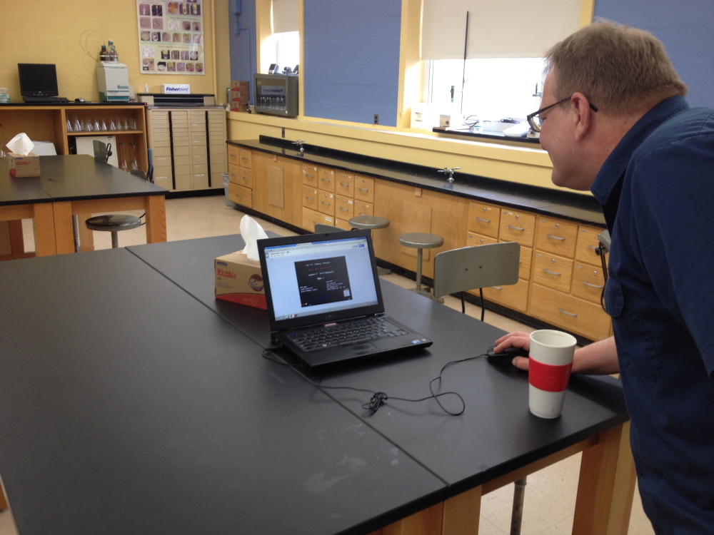 High tech: Terry Morocco, UMF associate professor of chemistry, demonstrates an online slideshow as part of his new online class Caveman Chemistry.
