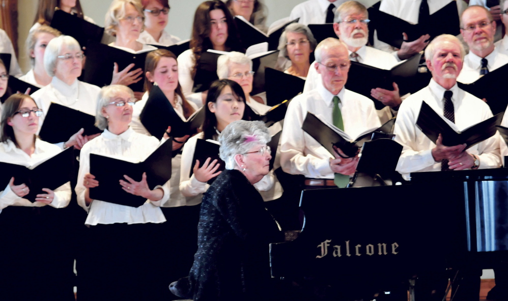FOND MEMORY: Pianist Patricia Hayden, wife of the late Joel Babcock Hayden Jr., plays as the UMF Community Chorus sings at the University of Maine in Farmington campus during a tribute to Joel Hayden on Sunday.